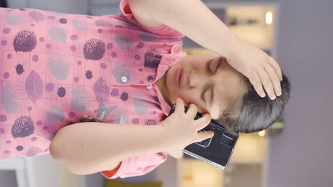 Vertical-video-of-Girl-child-getting-bad-news-on-the-phone-gets-upset.